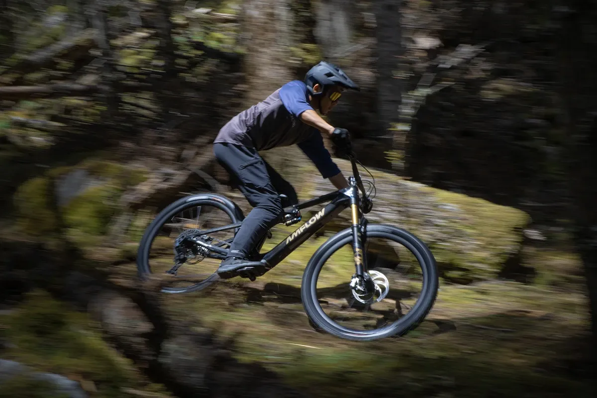 Amflow PL Carbon Pro eMTB riding a technical trail