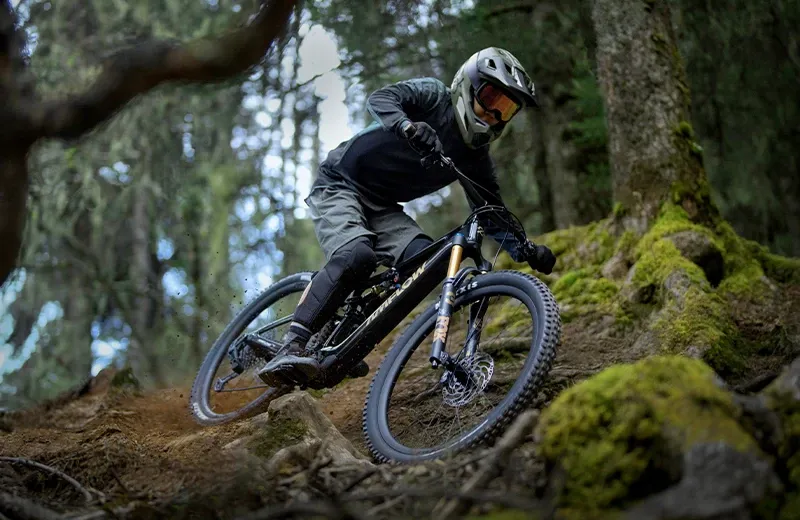 Amflow PL electric mountain bike descending a technical trail