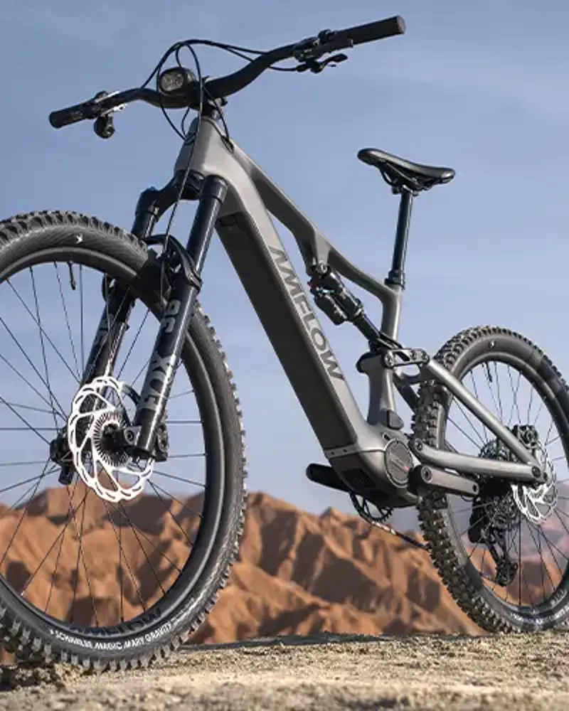 Amflow PR Carbon Pro electric mountain bike viewed from the front on rocky terrain