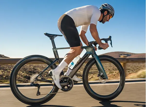Cyclist wearing performance bib shorts on a road ride