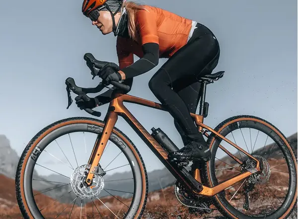 Cyclist riding in thermal bib tights during winter
