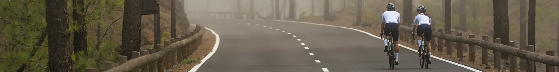 Road cyclists riding in bib shorts on the open road
