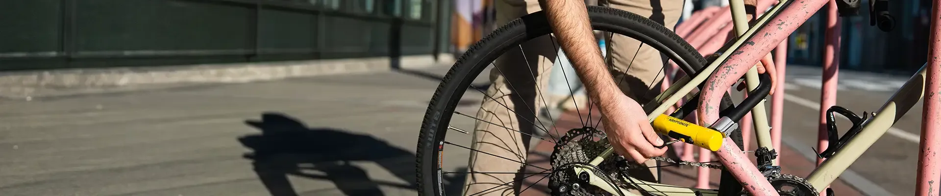 Locking a bike to a city bike stand with a D-lock