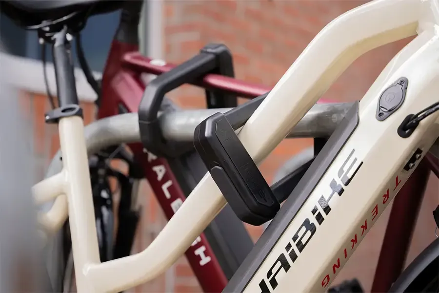 D-lock securing an electric bicycle frame to a stand