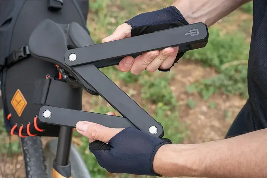Unfolding a folding bicycle lock ready to secure a bike