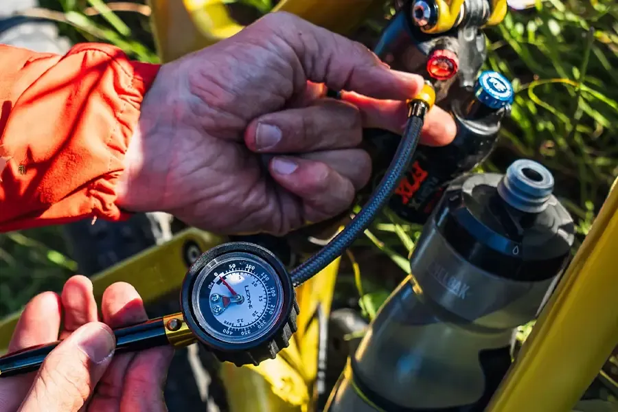 pumping up an mtb rear shock with shock pump