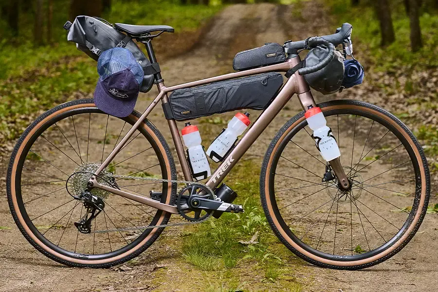 Bikepacking bike with frame bags and bottles mounted inside the frame and on the fork.