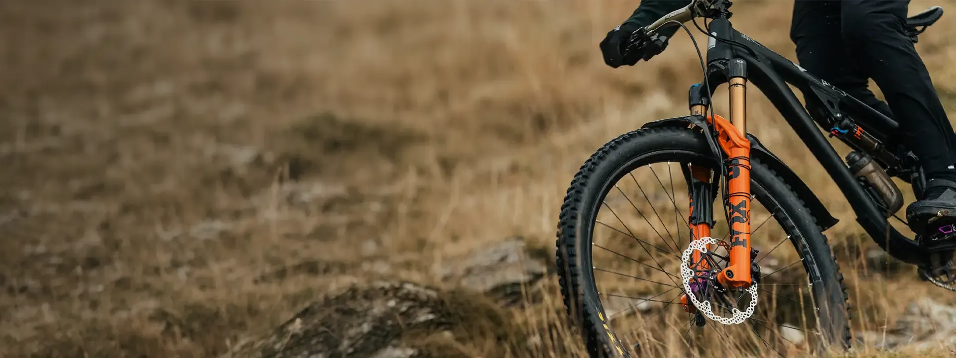 Mountain bike fitted with a Crud front mudguard on a dry trail