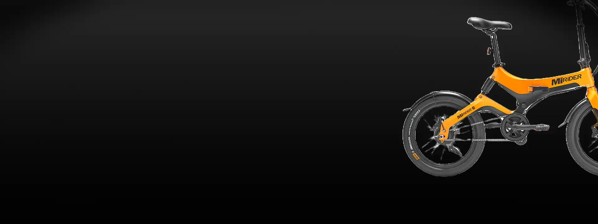 Orange MiRider folding e-bike shown against a dark background