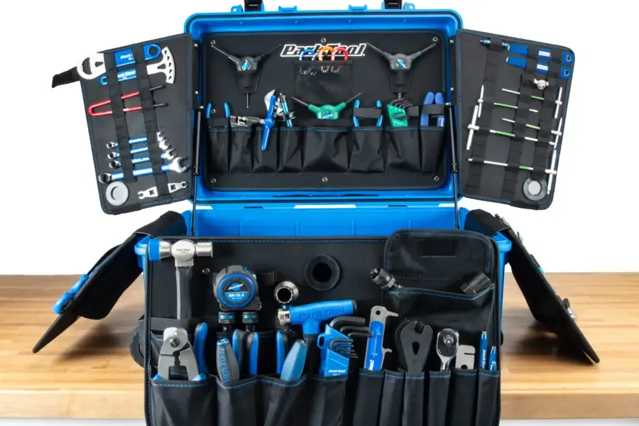 An open bicycle tool kit with organised tools and accessories