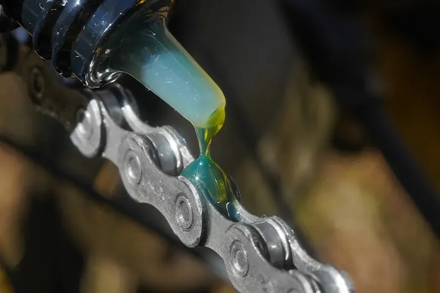 Lubricant being applied to a bicycle chain