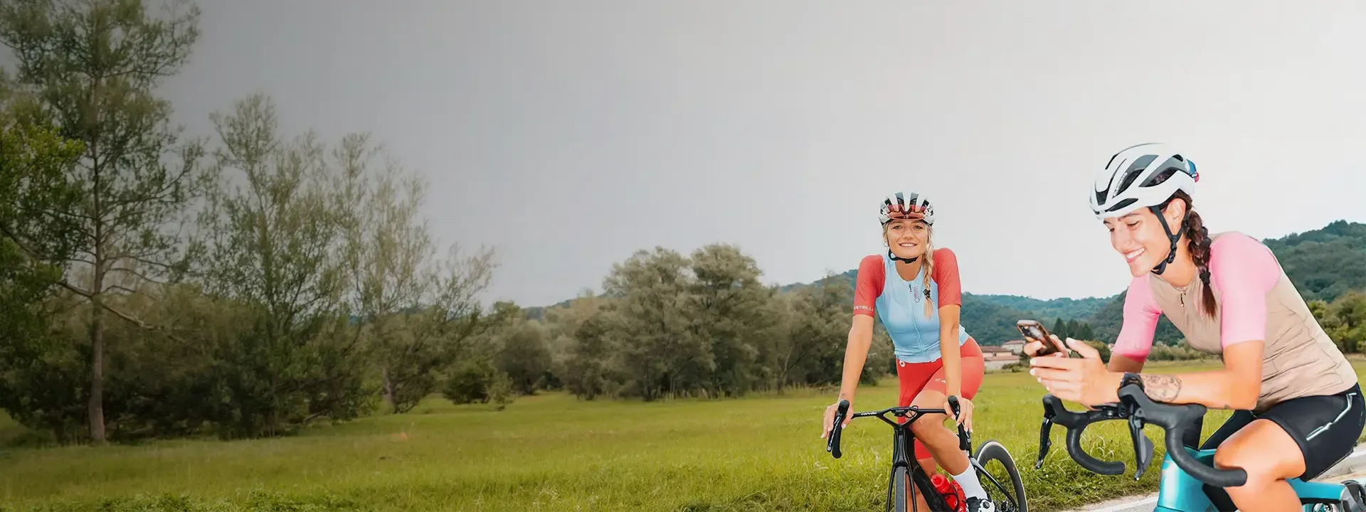 Three road cyclists riding together on a country lane