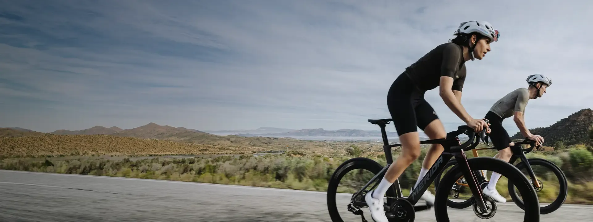 Road cyclists riding in padded cycling bib shorts during a warm weather road ride