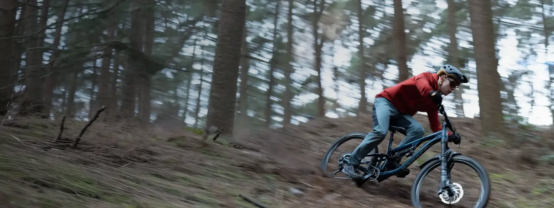 Mountain bike rider wearing a lightweight showerproof cycling jacket