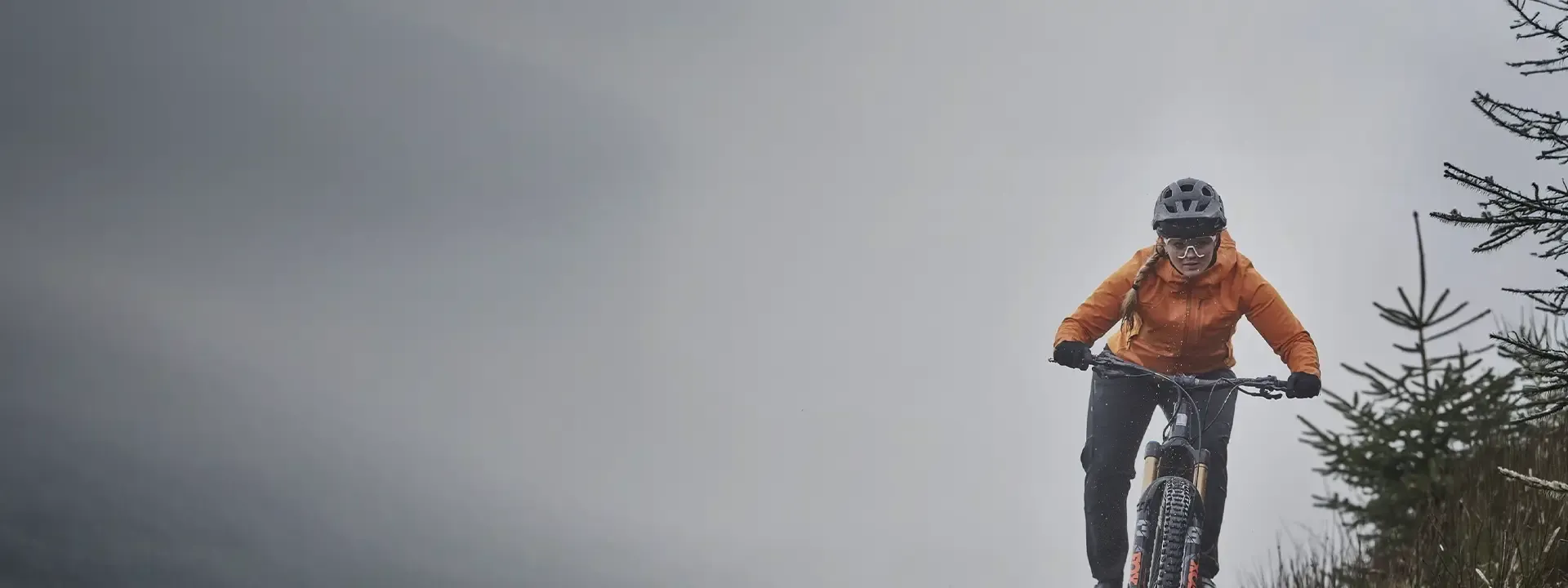 Mountain biker wearing waterproof a cycling jacket