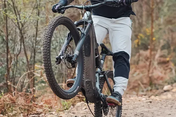 Front wheel of a Specialized Turbo Levo Evo - rider doing a manual detail