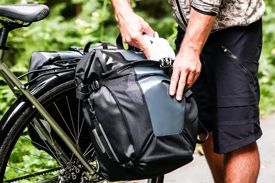 Putting things in a pannier bag mounted to a bicycle