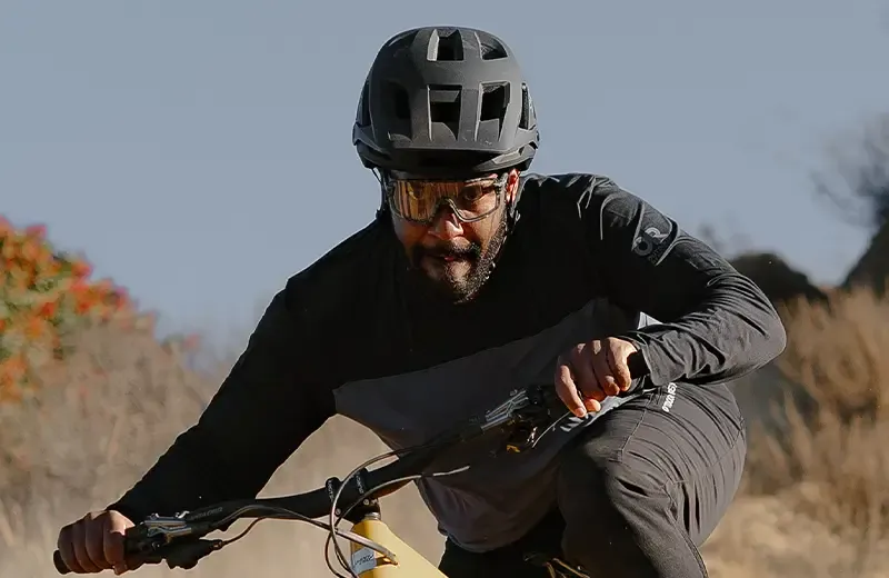 Eliot Jackson wearing performance MTB riding glasses on technical terrain