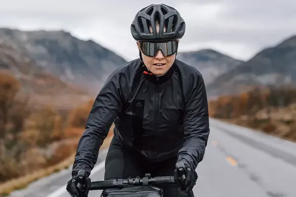 Cyclist wearing a breathable cycling jacket on a winter road ride