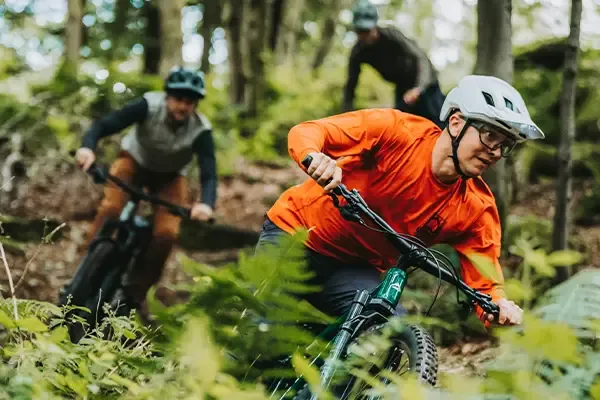 Mountain bike riders wearing long sleeve cycling jerseys
