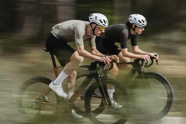 ROad cyclists wearing short sleeve cycling jerseys