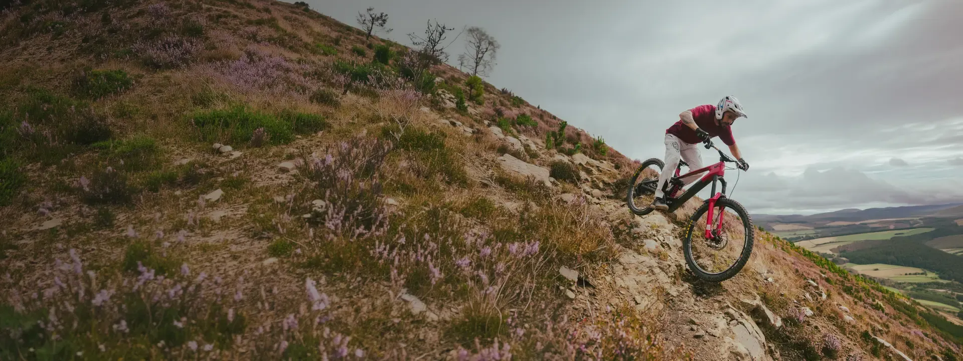 Rider tackling a rocky MTB trail on a Forbidden Dreadnought E eMTB