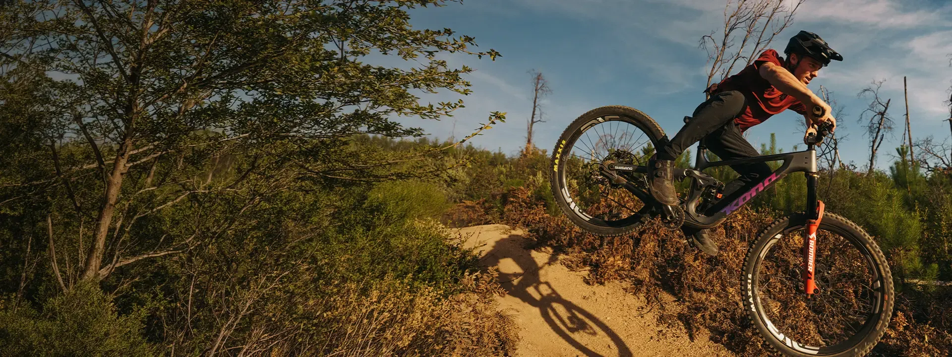 Mountain biker riding a technical trail in cycling footwear