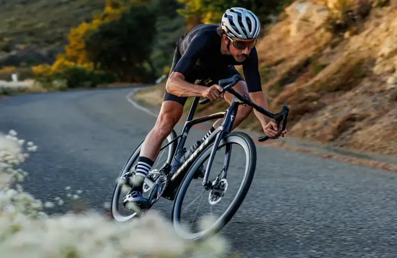 Rider corbering on a Giant Defy Advanced road bike
