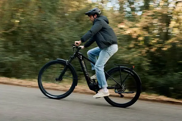 Rider travelling on a Giant Fathom E+ EX equipped electric bike