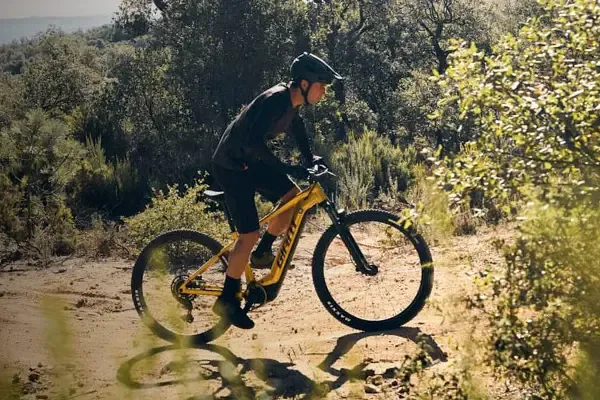 Rider exploring an off-road trail on a Giant Fathom E+ electric mountain bike