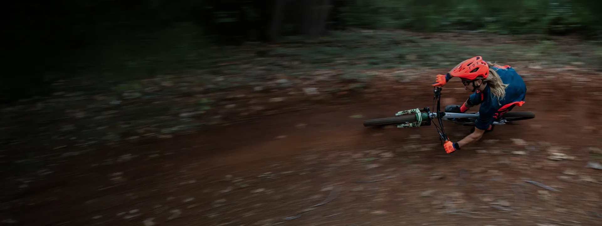 Cyclist wearing full-finger cycling gloves while riding