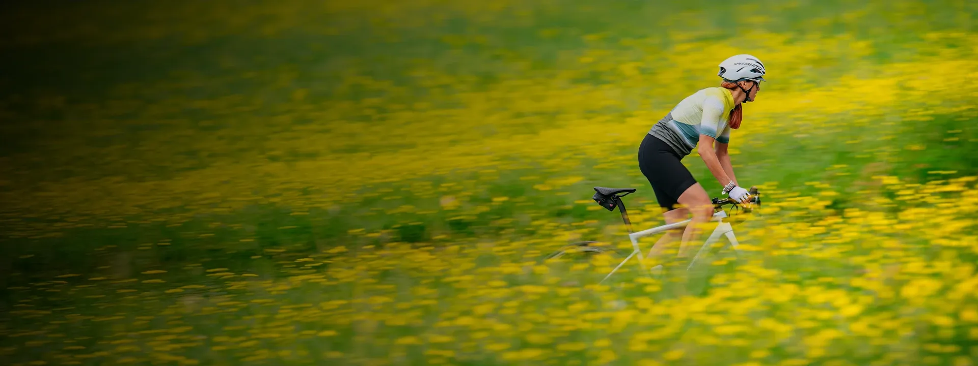 Road cyclist wearing lightweight cycling mitts on a summer ride
