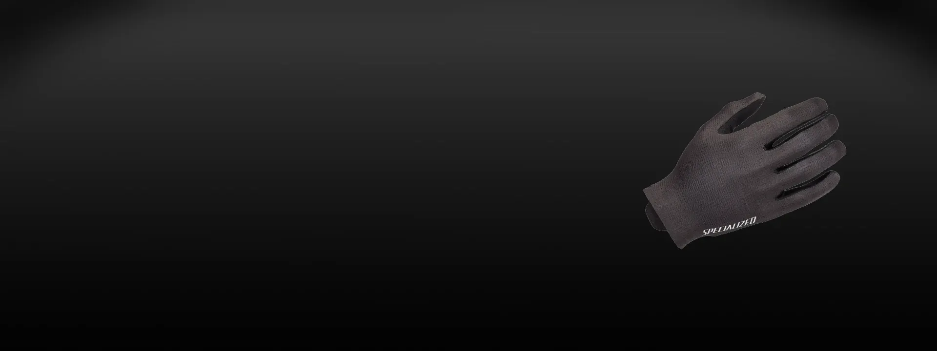 Cyclist wearing Specialized gloves on a mixed terrain ride