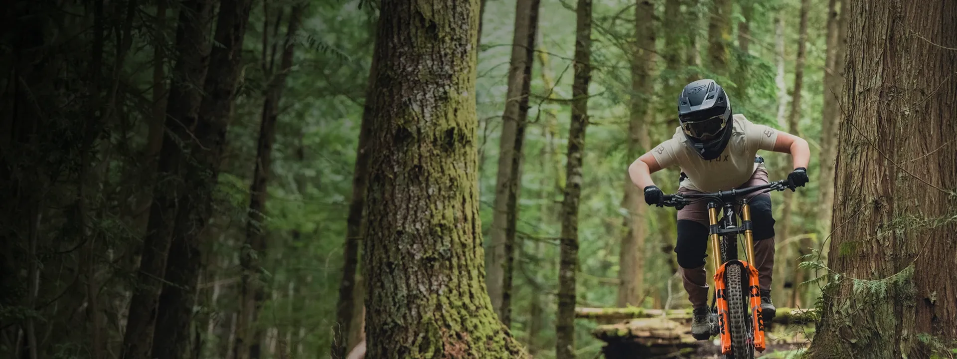 Female mountain biker wearing gloves on a trail ride