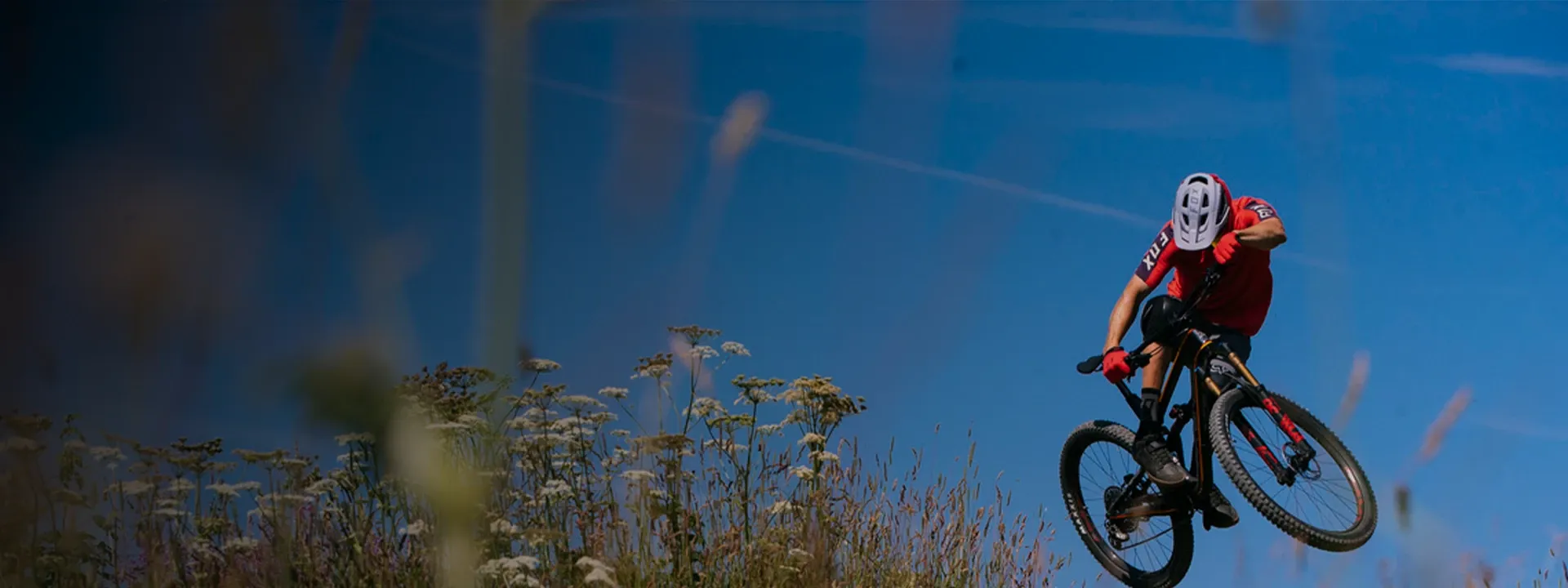Cyclist wearing cycling gloves while riding on mixed terrain