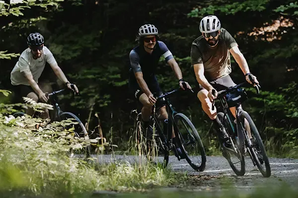 Three Gravel bike riders on Merida gravel bikes with handlebar packs and frame bags