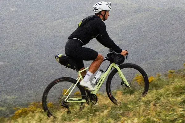 Riding a gravel bike set up for adventure riding and bikepacking