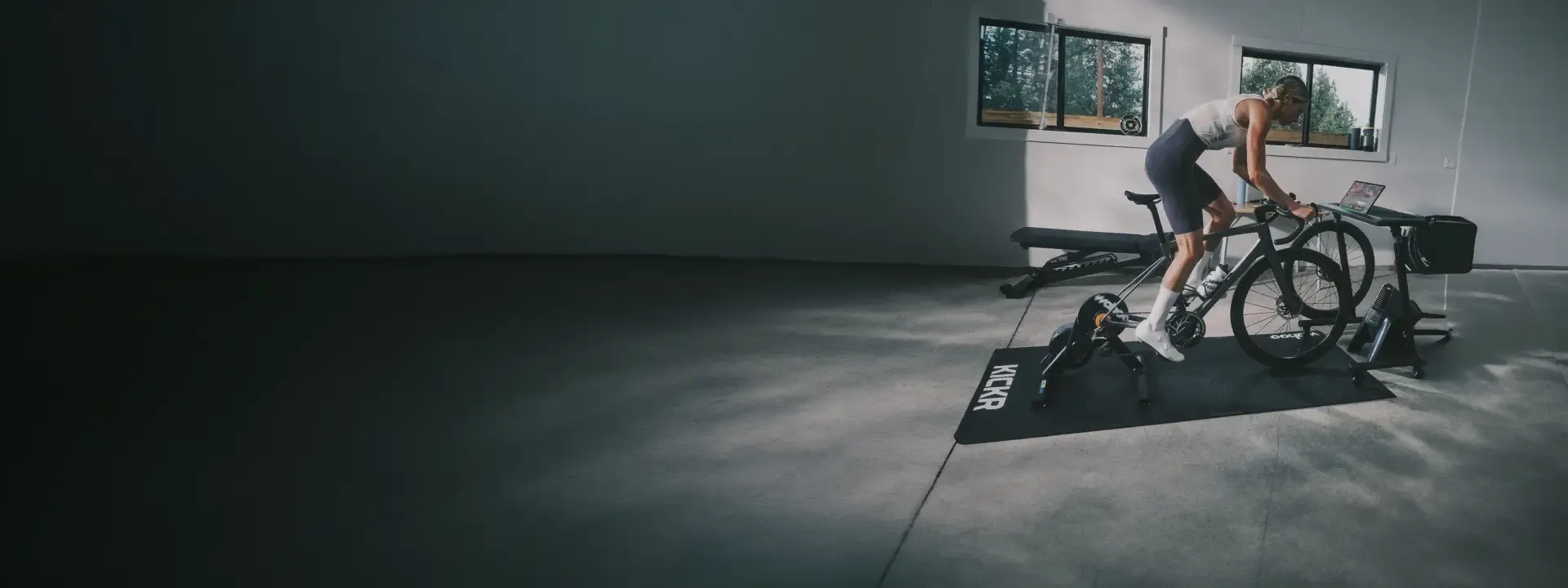 Cyclist riding a bike on a Wahoo indoor trainer in a home training room
