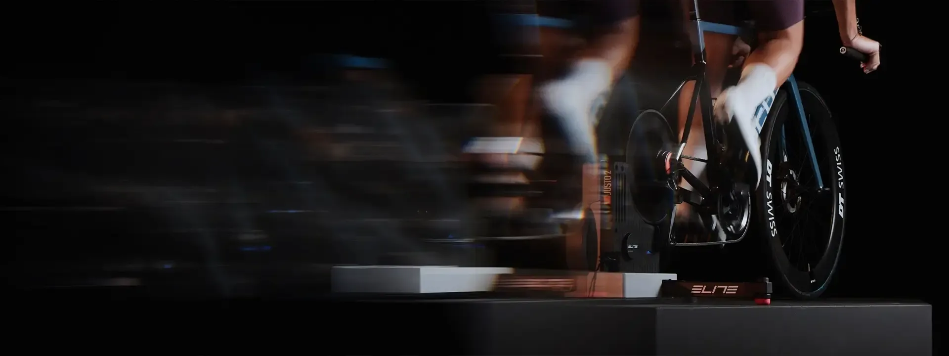 Close-up of a cyclist pedalling a road bike indoors