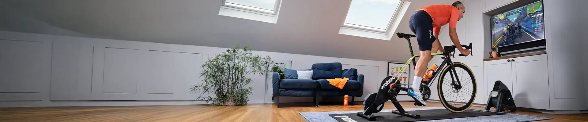 Rider using a turbo trainer at home in front of a screen