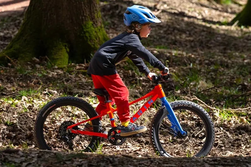 Child riding a 20 inch Marin Bear Valley kids bike on mixed terrain