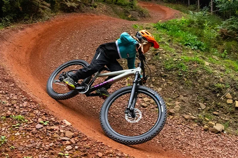 Young rider railing a turn on a Marin San Quentin 26 kids mountain bike