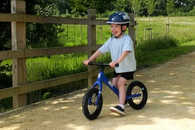 Child learning to ride on a Hoy Weee! balance bike