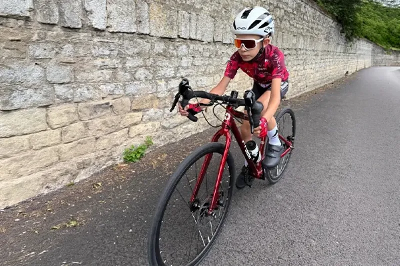 Junior rider on a Frog Road 67 kids road bike with drop handlebars
