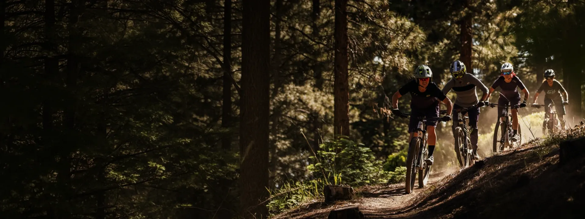 Mountain biker wearing MTB shorts and trousers on a trail ride