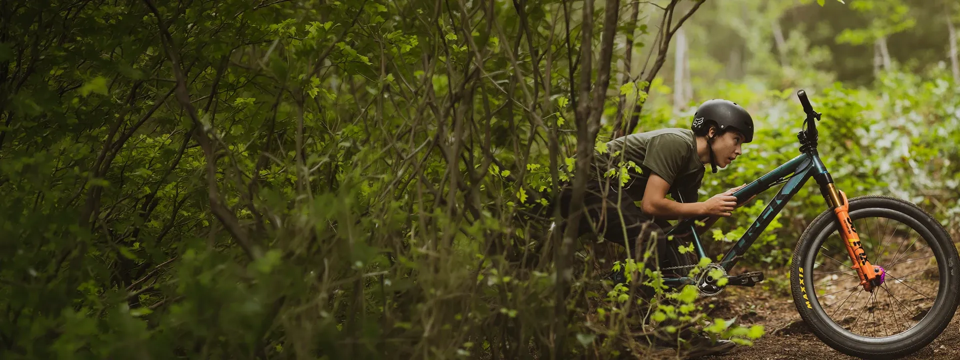 Mountain biker wearing a technical MTB T-shirt on a trail ride