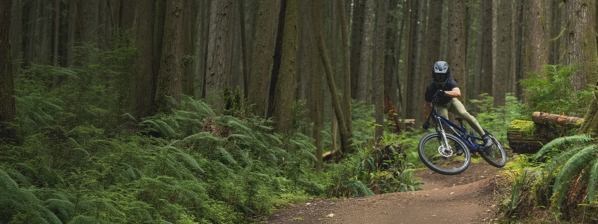 Mountain biker wearing MTB trousers on a technical trail ride