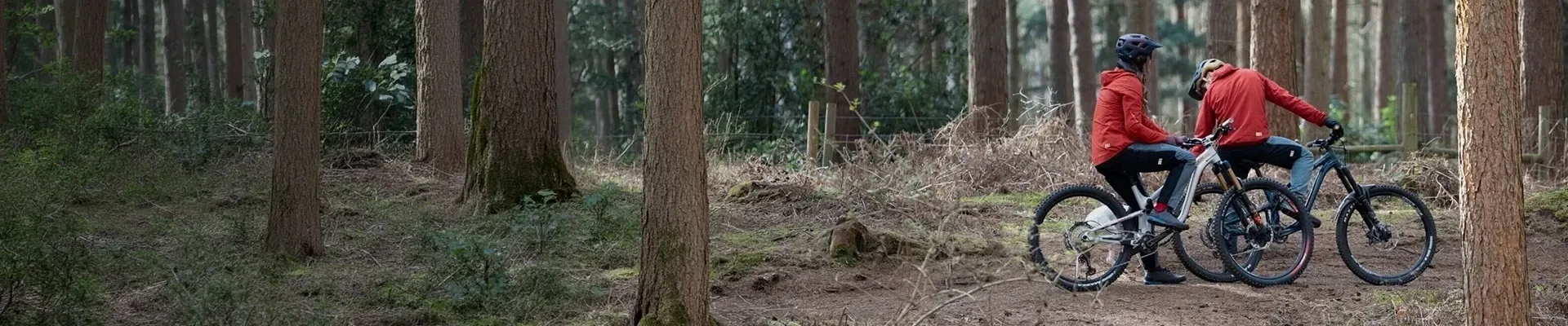 Mountain bikers wearing trail clothing on off-road terrain