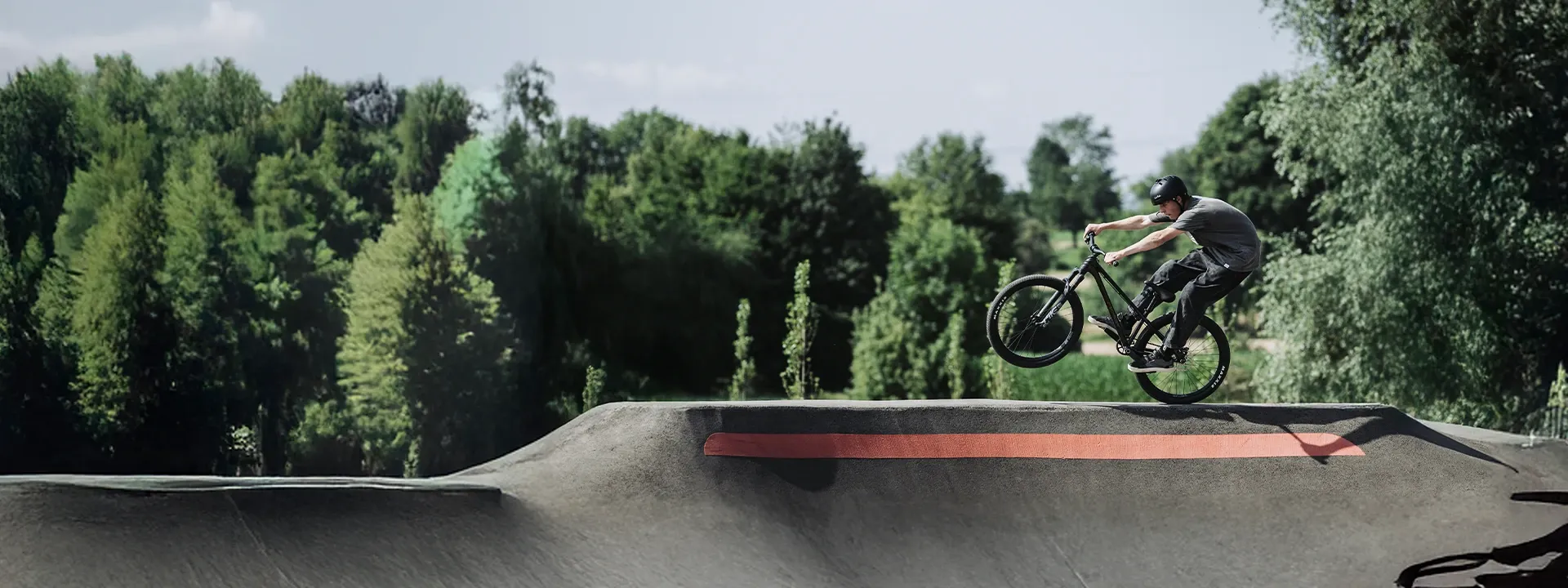 26-inch mountain bike on dirt jump terrain