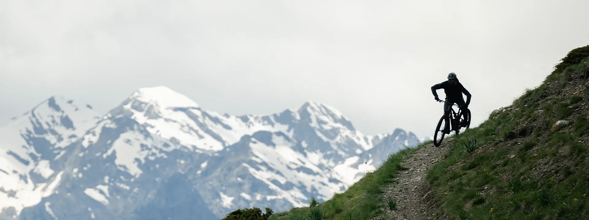 Rider descending on a full suspension mountain bike